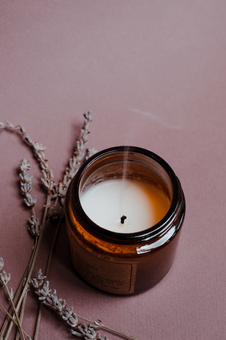 A Candle in a Brown Glass Bottle